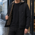 Men's black quilted jacket with drawcord hood