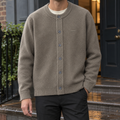 Man wearing a brown textured knit button-front cardigan