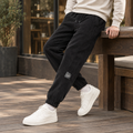Men's corded jogger bottoms in black with elasticated ankle cuffs