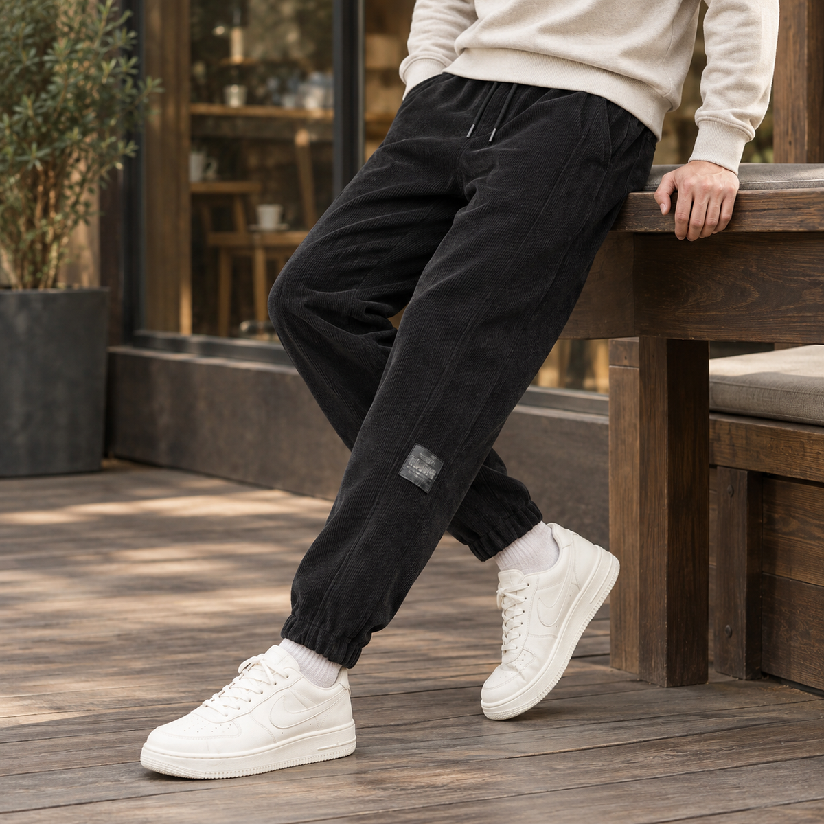 Men's corded jogger bottoms in black with elasticated ankle cuffs