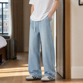 Men's wide leg denim jeans in light blue with drawstring waist