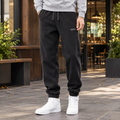 Men's black relaxed jogger bottoms with drawstring waist