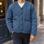 Men's blue denim jacket with quilted lining and patch pockets