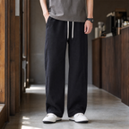Men's relaxed fit cotton trousers in black with drawstring waist