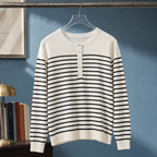 Man wearing a white and black striped cashmere jumper